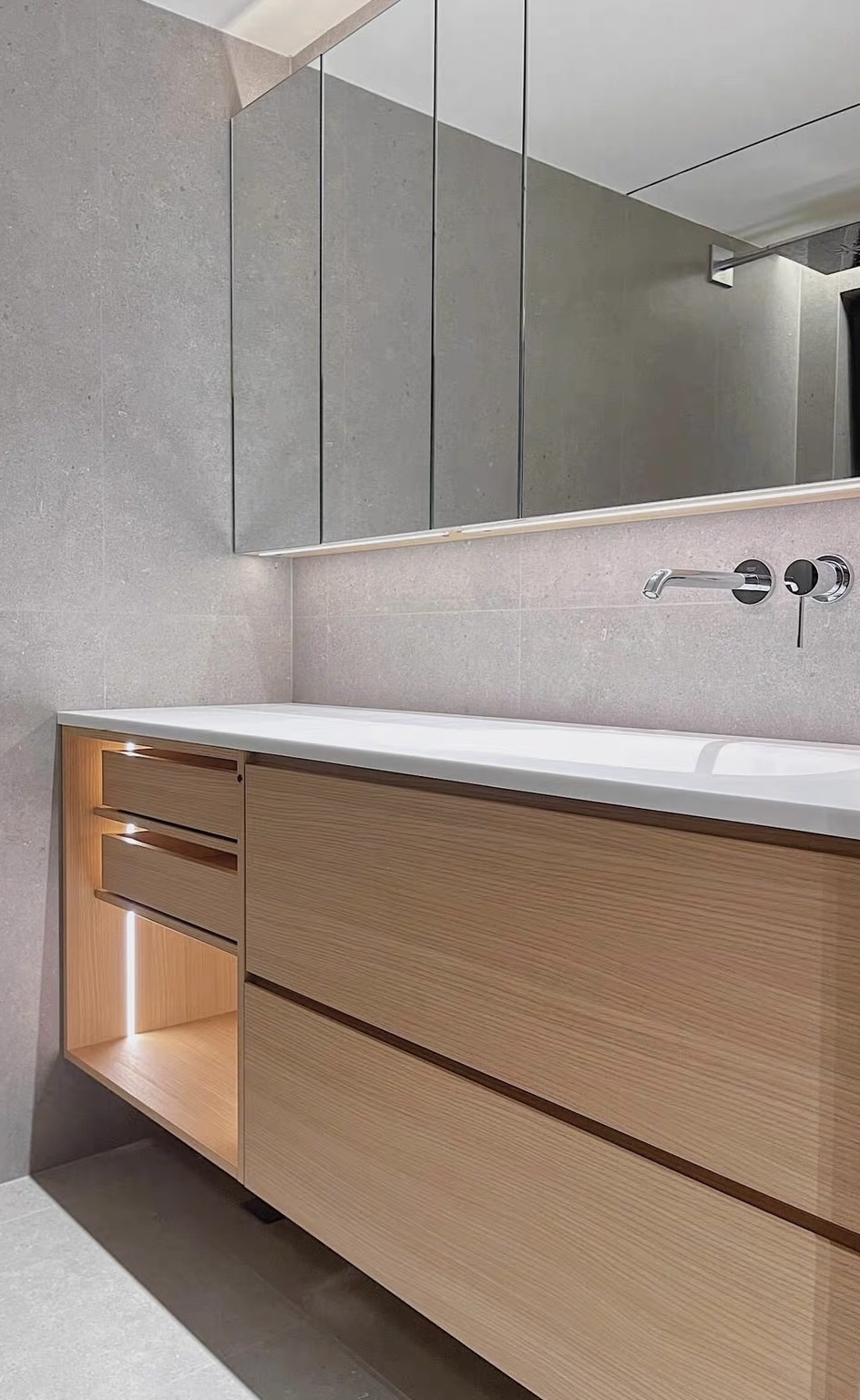 Lave bespoke oak vanity with integrated sintered stone basin, wall-mounted matte black tap and herringbone floor — Minimal Japandi collection