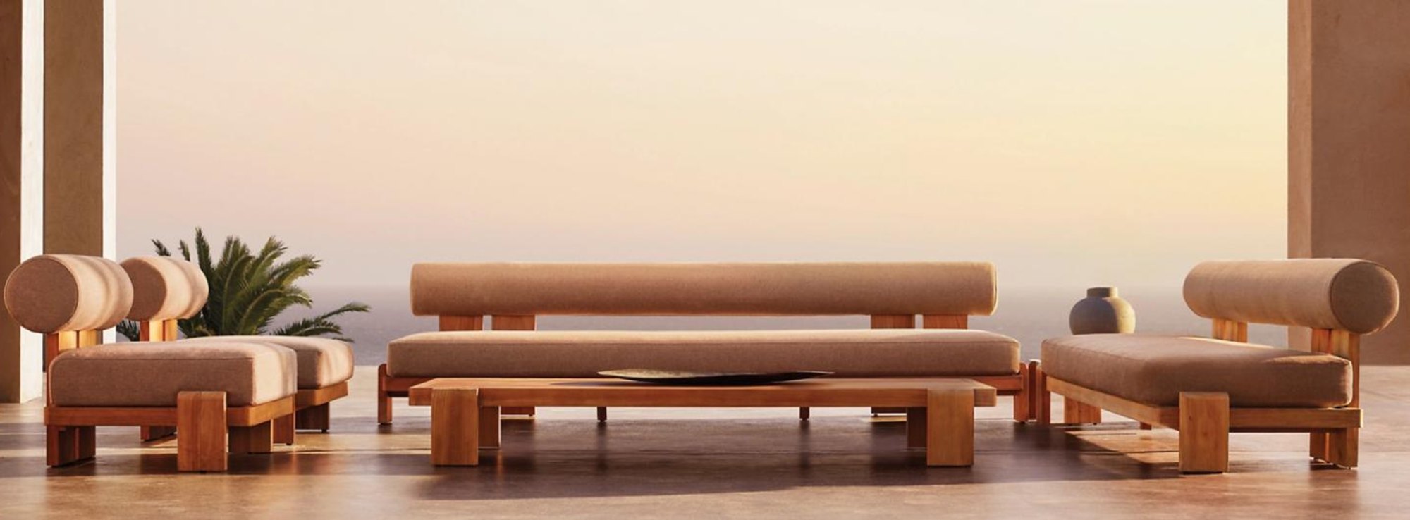 VIG solid teak low-profile daybeds with bolster backrests at sunset overlooking the sea