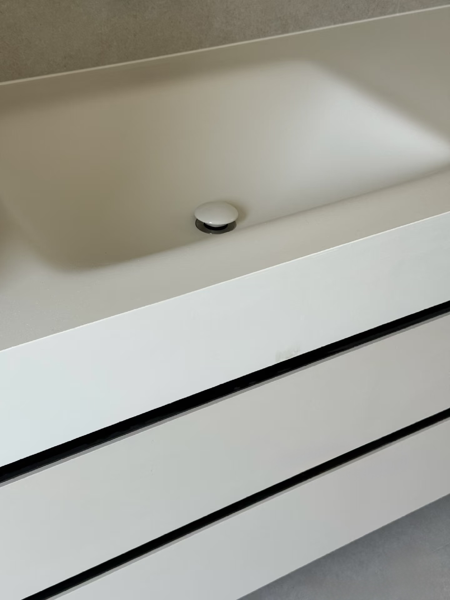 Lave 1200mm bespoke bathroom vanity in custom light grey cabinet finish with 20mm counter drop sintered stone basin, installed in Bath