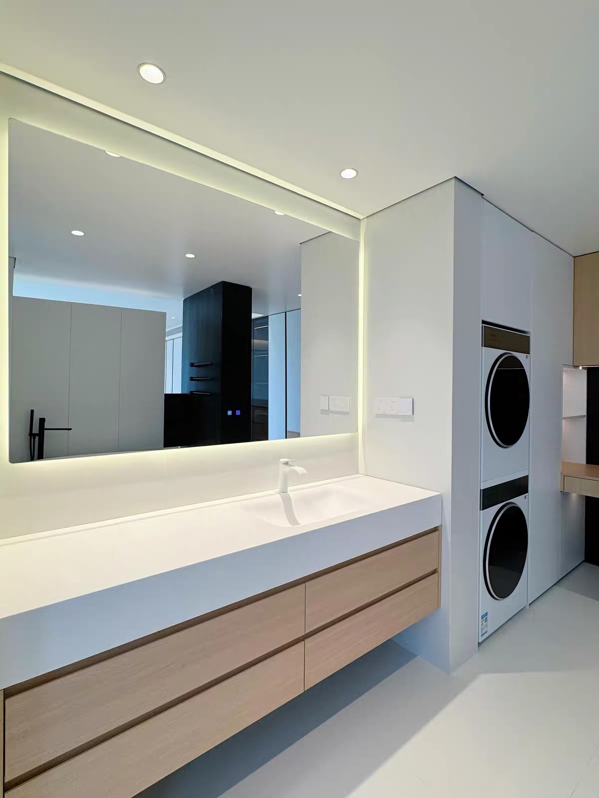 Emily S — installed Lave floating oak vanity with integrated basin and backlit mirror, front view