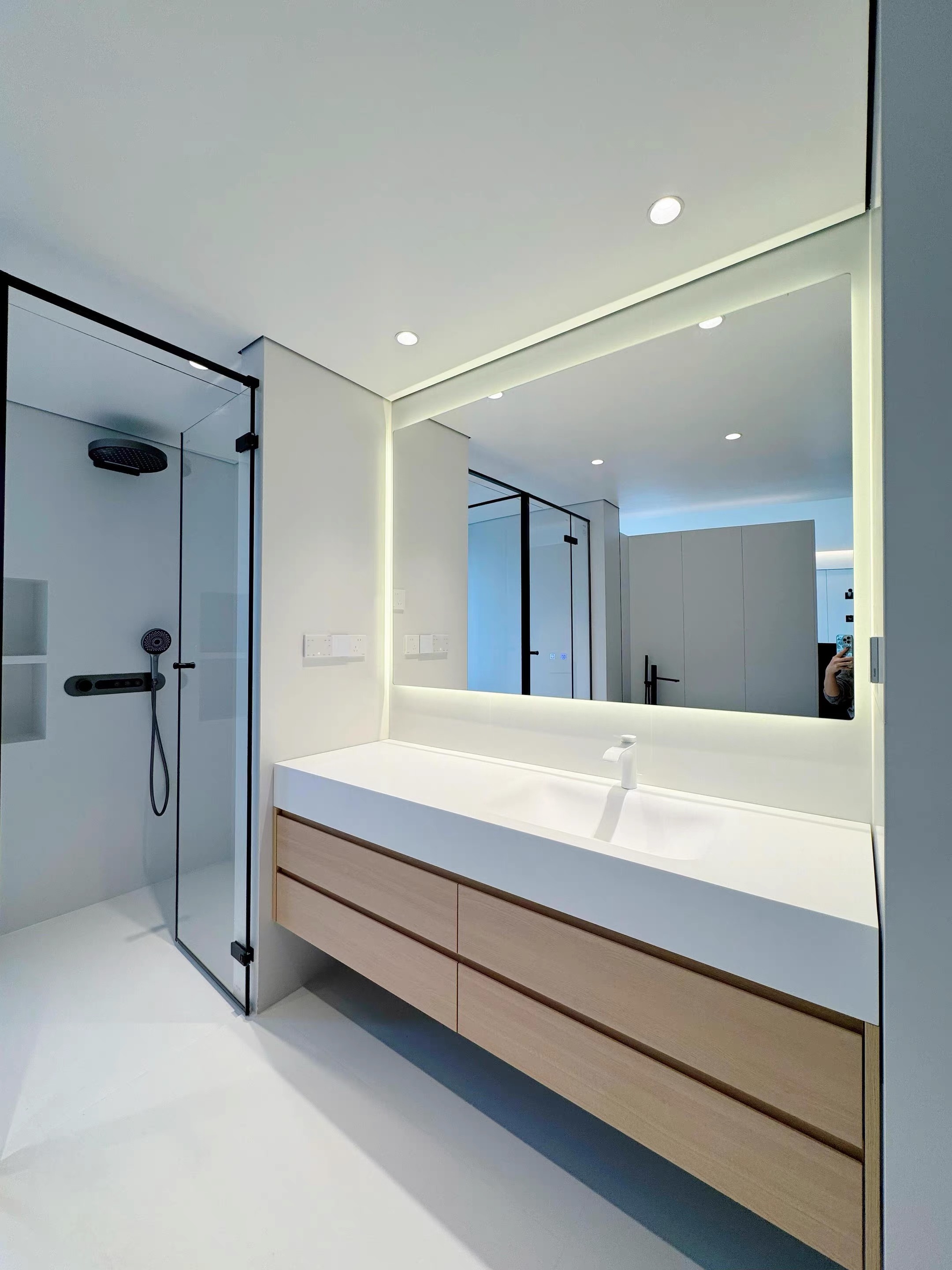 Emily S — installed Lave basin, angled view showing glass shower enclosure